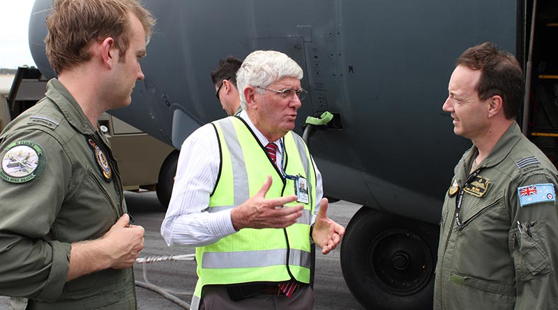 RAAF Museum Curator Dave Gardner speaks with Flying Officer Brett Aaker (left) and Squadron Leader Robert Sokol, pilots of the final C-130H Hercules flight to the RAAF Museum at Point Cook.