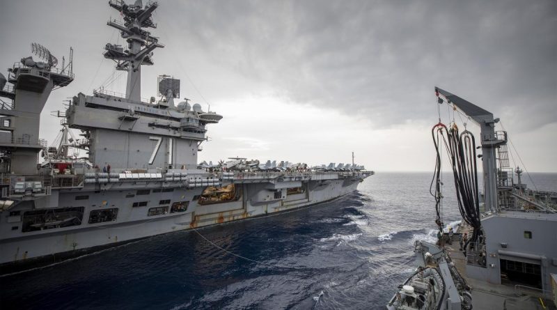 HMAS Sirius conducts a replenishment at sea with USS Theodore Roosevelt. Photo by Leading Seaman Thomas Sawtell.