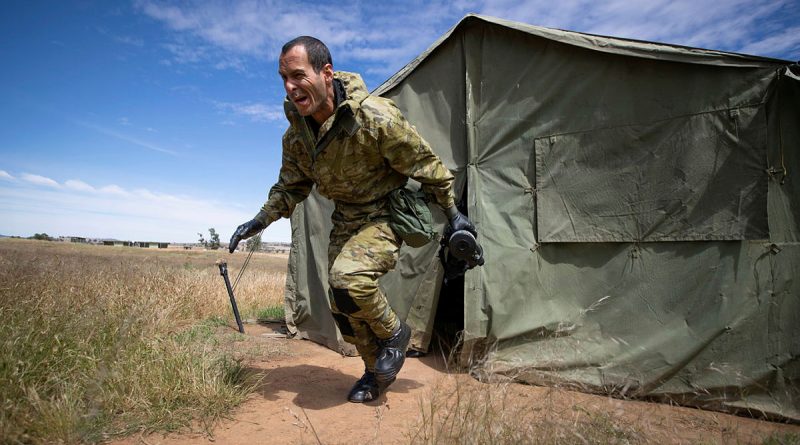 Recruit Nomar Romero-Perez from Charlie Company, Army Recruit Training Centre, exits the mask testing area during CBRN training at Kapooka, New South Wales. Photo by Trooper Jonathan Geodhart.