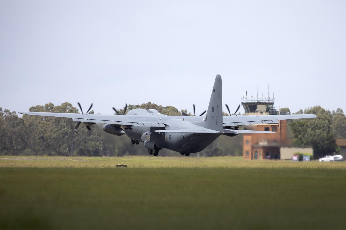 During Spouse Orientation Day, wives board a C-130 Hercules - NARA