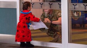 Friends and family were on hand to greet NZDF personnel returning from England following their Ukrainian training mission. NZDF photo.