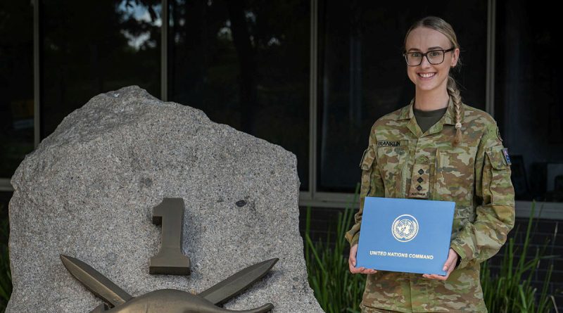 Captain Bronte Franklin with her United Nations Award received during Exercise Freedom Shield, stands outside Headquarters 1st (Australian) Division, Gallipoli Barracks, Brisbane. Story by Captain Peter Nugent. Photo by Corporal Miguel Anonuevo.