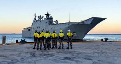 Port Services Darwin members stand by as HMAS Adelaide approaches the newly built Kuru wharf at HMAS Coonawarra in Darwin, NT. Photos by Leading Seaman Ernesto Sanchez.