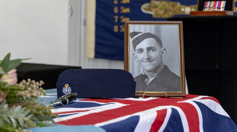 Flight Sergeant Gordan Hamilton's portrait on display during the memorial service of four WW2 RAAF servicemen at RAAF Base Amberley. Story by Wing Commander Bruce Chalmers. Photos by Aircraftman Campbell Latch.