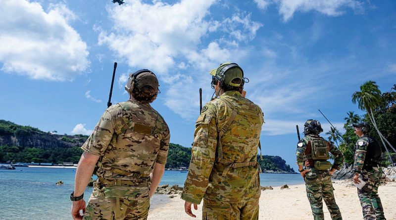 Joint terminal attack controller Bombardier Jackson Lawrence (right) alongside JTAC and Ground Forward Air Controllers (GFAC) from the UK and Malaysia call in close air support from a Republic of Singapore Air Force F-16 in the Tioman Island group, Malaysia during Exercise Bersama Shield 2024. Story by Lieutenant Mick Wheeler.