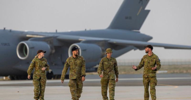 RAAF 36 Squadron personnel walk from a C-17 Globemaster towards Hurley’s Hangar after arriving at Australia’s main operating base in the Middle East region. Story and photo by Corporal Jacob Joseph.