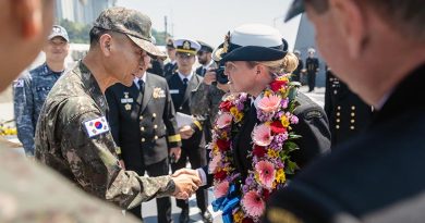 Republic of Korea Navy Commander Dae-Joong Lee shakes hands with Commanding Officer HMAS Hobart, Commander Tina Brown during an official welcome meeting in Busan, Republic of Korea as part of HMAS Hobart's regional presence deployment. Photo by Leading Seaman Matthew Lyall.