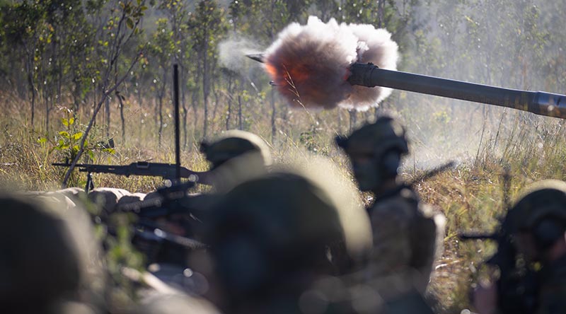 Gunners from the 1st Regiment, Royal Australian Artillery, fire an M777 Howitzer while taking up defensive firing positions, at Shoalwater Bay Training Area. Photo by Private Alfred Stauder.
