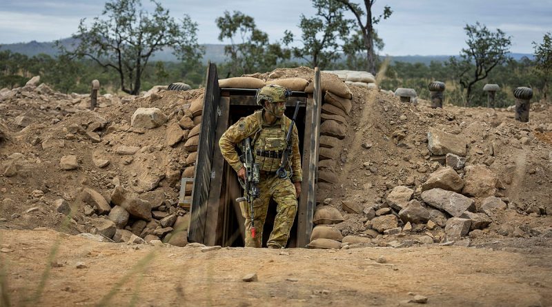 An Army soldier exits the underground command post bunker during Exercise Brolga Run at Townsville Field Training Area, Queensland. Story by Captain Brittany Evans. Photos by Trooper Dana Millington.