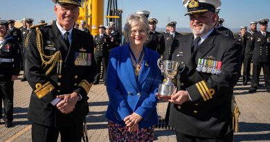 Commanding Officer HMAS Rankin Commander Simon O’Hehir holds the Gloucester Cup, accompanied by Commander of the Australian Fleet Rear Admiral Chris Smith and Governor of South Australia Frances Adamson. Story by Lieutenant Commander Andrew Ragless. Photo by Petty Officer Luke Scott.