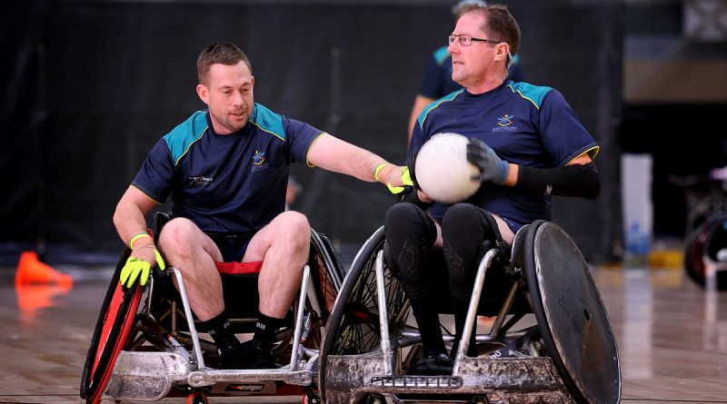 Team Australia's Ben Owens, right, moves past Jamie Adam Smyth during a wheelchair rugby training session in preparation for the Warrior Games 2024. Story by Flying Officer Tina Langridge. Photo by Flight Sergeant Christopher Dickson.
