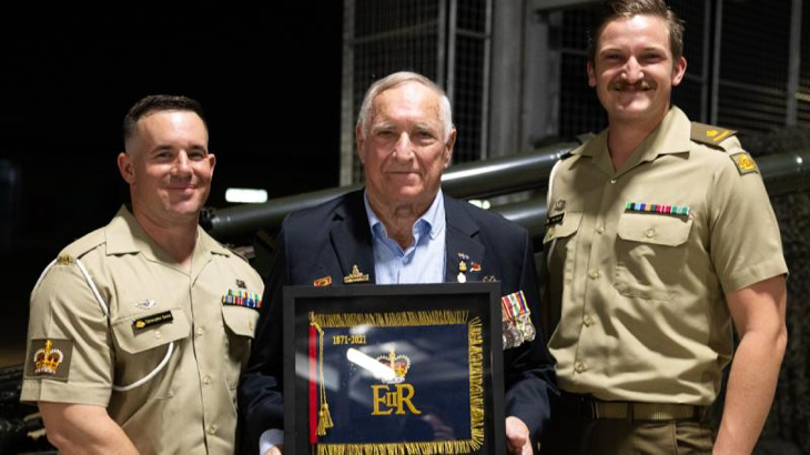 Ken Murphy stands with Battery Commander Major Jack Bagwill, right, and Battery Sergeant Major, Warrant Officer Class Two Chris Saetta, following the presentation of the Queen's Banner at Robertson Barracks. Story by Captain Annie Richardson.