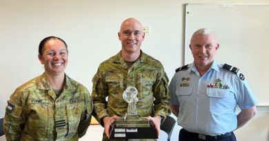 Leading Aircraftman Paul Street, centre, receives the CSG Aviator of the Year and bronze commendation for his work designing and building the frame for the Health OCU BlueRoom simulator. Story by Corporal Jacob Joseph.