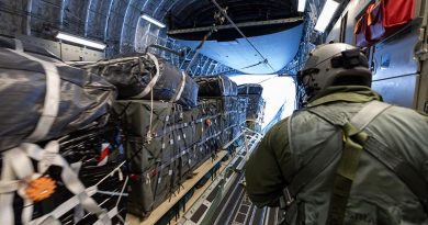 No. 36 Squadron Loadmaster Corporal Deon Jones watches as palletised cargo rolls off the ramp of a Royal Australian Air Force C-17A Globemaster III during an airdrop of supplies to Mawson Research Station, Antarctica. Photo by Petty Officer Bradley Darvill.