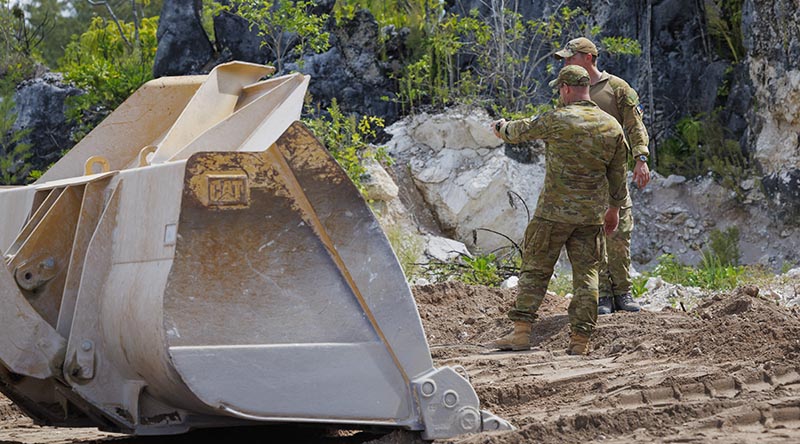 Australian and partner military personnel work on clearing a site to be used to dispose of WWII remnants during Operation Render Safe in Nauru. Photo by Sergeant Craig Barrett.