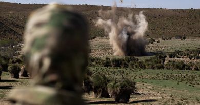 A Joint Explosive Ordnance Support - West member watches the blast of an explosive ordnance disposal task on farmland at Two Rocks, Western Australia. Photo by Petty Officer Craig Walton.