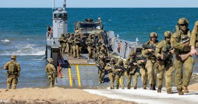Army soldiers from the Australian Amphibious Force disembark a littoral landing craft during wet-and-dry environment rehearsals at Cowley Beach Training Area. Story and photos by Corporal Michael Rogers.