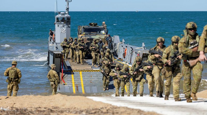 Army soldiers from the Australian Amphibious Force disembark a littoral landing craft during wet-and-dry environment rehearsals at Cowley Beach Training Area. Story and photos by Corporal Michael Rogers.