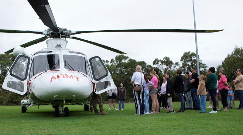 Soldiers from 5th Aviation Regiment present a safety brief to Townsville Hospital Foundation charity 'Brighter Lives' recipients on the Army-leased AW139 helicopter. Story by Captain Tadek Markowski. Photos by Gunner Ryan Kearney.