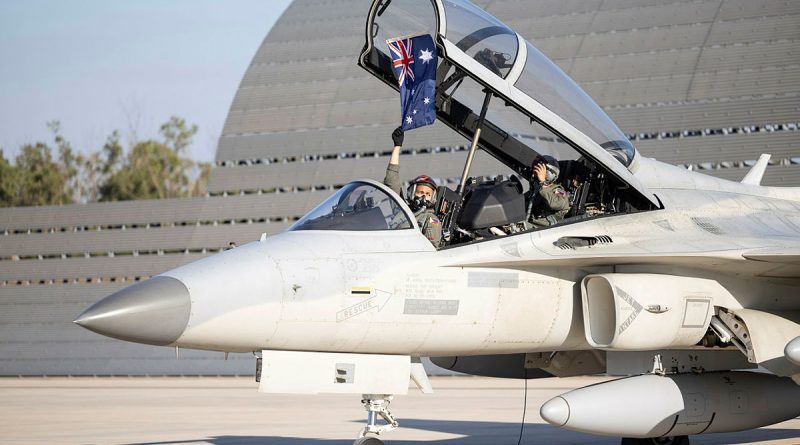 A Philippine Air Force FA-50PH pilot holds an Australian flag after arriving at RAAF Base Darwin, ready for Exercise Pitch Black 24. Story by Flight Lieutenant Imogen Lunny. Photos by Leading Aircraftwoman Maddison Scott.