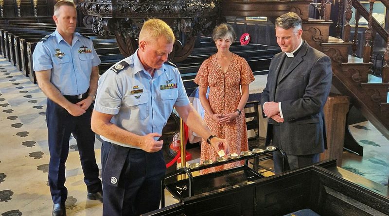 From left, Chief of Air Force Air Marshal Stephen Chappell, Warrant Officer of the Air Force Ralph Clifton; Saskia Hobbs and Reverend Mark Perry take part in the lighting of the candle ceremony. Story and photos by Lieutenant Commander John Thompson.