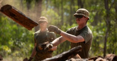 Sapper Jack Henderson, from 1st Combat Engineer Regiment, throws wood on a pile for the Garma Festival during Exercise Predator's Run in Nhulunbuy, NT. Story and photos by Corporal Jacob Joseph.