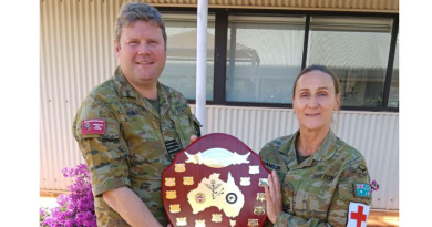 Sergeant Deborah Williamson, right, receives the McCarthy Rowbottom Jones Memorial Award by Group Captain John Rollo. Story by Corporal Melina Young.