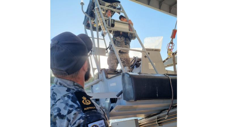 Royal Australian Navy sailors work onboard HMNZS Manawanui with Royal New Zealand Navy sailors to repair a rigid-hulled inflatable boat. Story by Leading Seaman Harry Boardman.