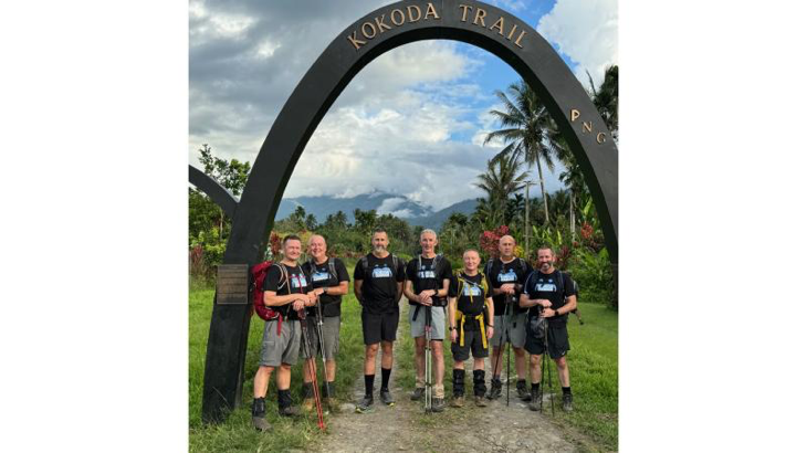 Warrant Officer Rodney Wallace and Squadron Leader Jamie Stirling (fourth and fifth from left) with the other 11 Squadron personnel at Owens Arch along the Kokoda Track. Story by Corporal Jacob Joseph.