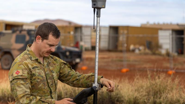 Australian Army surveyor Sapper Shaun Jackson from 6th Engineer Support Regiment completes a surveying task as part of the 2024 Army Aboriginal Community Assistance Programme in Amata, SA. Story by Flight Lieutenant Marina Power. Photo by Private Jack Hayes.