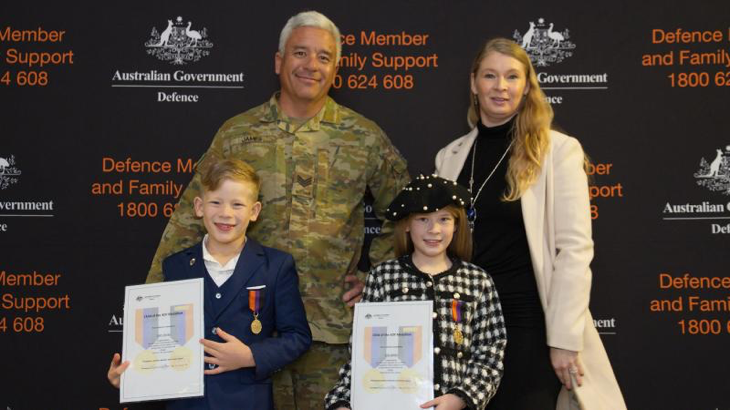 Parents, Sergeant Kim and Mrs Clare James with their kids, displaying their Child of ADF Medallions and certificates. Story by Ben Wickham. Photos by Ben Wickham.