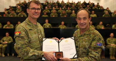 Deputy Chief of Army Major General Christopher Smith, left, presents Warrant Officer Class 1 Rodney Speter with his two Federation Stars for 45 years of service. Story and photos by Warrant Officer Class 2 Andrew Hetherington.