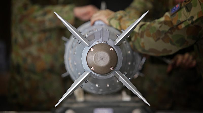 RAAF armament technicians prepare a guided bomb unit (GBU-32) for use by the Air Task Group in the Middle East region. Photo by Corporal Ben Dempster.