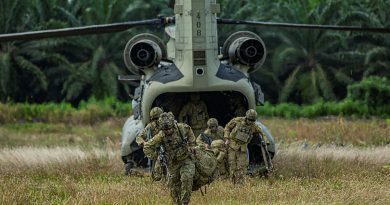 Soldiers from Rifle Company Butterworth exit a US Army Chinook during the field training exercise during Exercise Keris Strike in Sabah, Malaysia. Story by Lieutenant Chloe Reay. Photo by Evangelos Wilson.