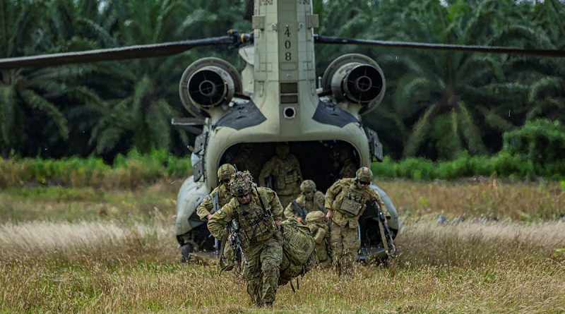 Soldiers from Rifle Company Butterworth exit a US Army Chinook during the field training exercise during Exercise Keris Strike in Sabah, Malaysia. Story by Lieutenant Chloe Reay. Photo by Evangelos Wilson.