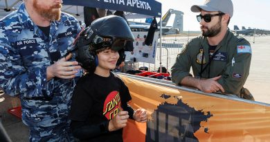 Angus, from the Starlight Children’s Foundation, tries on an F-35A helmet with the help of Corporal Daniel Lake, a 3 Squadron life support fitter, at the Pitch Black open day at RAAF Base Darwin. Story by Flying Officer Jamie Wallace. Photos by Sergeant David Gibbs.