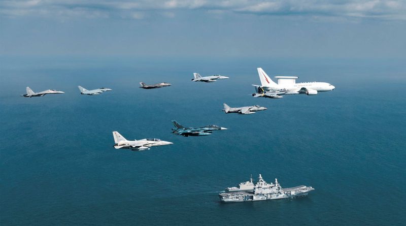 A Royal Australian Air Force E-7A Wedgetail leads a formation of aircraft past the Italian Navy aircraft carrier ITS Cavour during Exercise Pitch Black 2024. Story by Squadron Leader Eamon Hamilton. Photo by Corporal Samuel Miller.