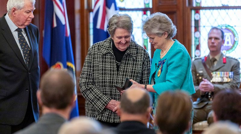 Governor of South Australia Frances Adamson, right, presents Elizabeth Buchanan with a Medal for Gallantry, which was posthumously awarded to her father, the late Pilot Officer Warren Frank Cowan, for his actions on July 22, 1942. Story by Flight Lieutenant Robert Cochran. Photos by Sergeant David Cotton.