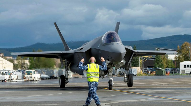 An aviator marshalls a 75 Squadron F-35A Lightning II at Eielson Air Force Base, Alaska. Photos by Sergeant Hayden Young.