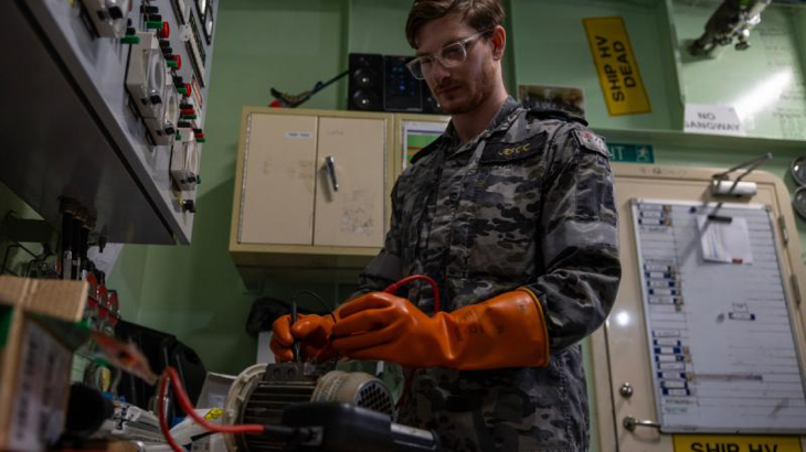 Navy sailor Leading Seaman Marine Technician Electrical Nikolas Jercic conducts electrical testing on board HMAS Adelaide. Story and photo by Corporal Michael Rogers.