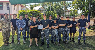 RAAF Sergeant Aaron Bennet, centre right, with 2 Squadron personnel after cleaning up Billeroy House Community Centre in Darwin. Story by Corporal Jacob Joseph.