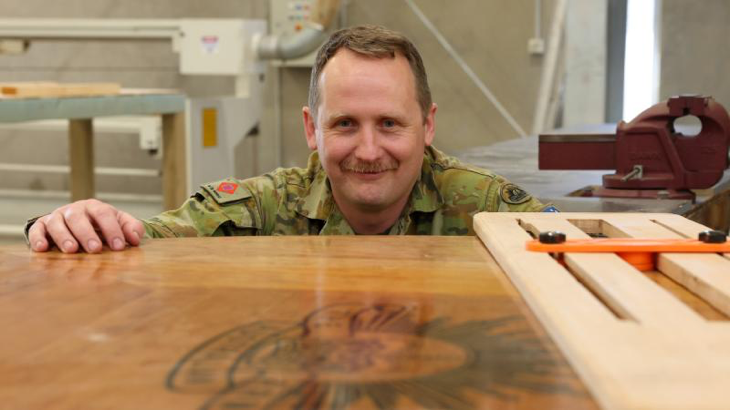 Sergeant Alan Rowell with the conference table he made for the Chief of Army through the Holsworthy MakerSpace. Story and photos by Warrant Officer Class Two Max Bree.