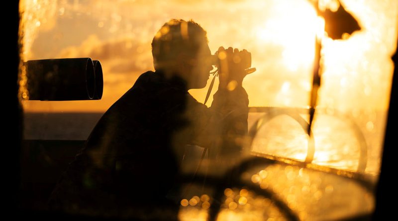 Able Seaman Boatswain’s Mate Luke Handley looks out from the bridge wing as HMAS Sydney takes part in a man-overboard exercise. Story by Lieutenant Tahlia Merigan. Photos by Leading Seaman Daniel Goodman.