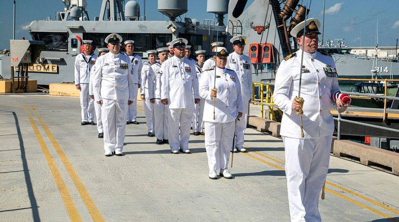 Members of ship's company of HMAS Broome prepare to march past during the vessel's decommissioning ceremony at HMAS Coonawarra, Darwin. Story by Lieutenant Commander Jonathan White. Photos by Able Seaman Jackson Dowling.