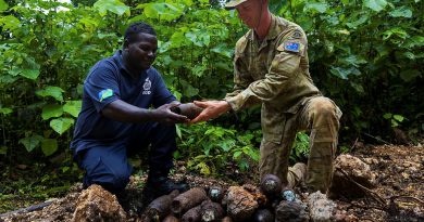 Australian Army Corporal Solomon Boyd and Royal Solomon Islands Police Force officer Tusa consolidate explosive remnants of war during Operation Render Safe, Munda, Solomon Islands. Story by Sergeant David Said. Photos by Corporal Sam Price.