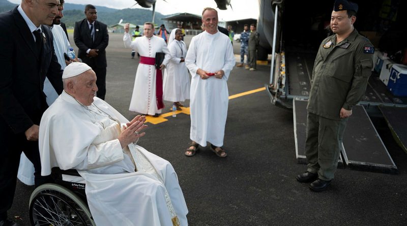 Air Force Squadron Leader Jacob Ralph, of 37 Squadron, waits to meet Pope Francis prior to boarding a C-130J in Vanimo, Papua New Guinea. Story by Tastri Murdoch.