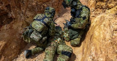 Army medics treat a simulated casualty during a trench warfare CBRN scenario as part of Exercise Rendezvous Acacia at the Wide Bay Training area, Queensland. Story b y Captain Nicholas Marquis. Photos by Leading Seaman Nadav Harel.