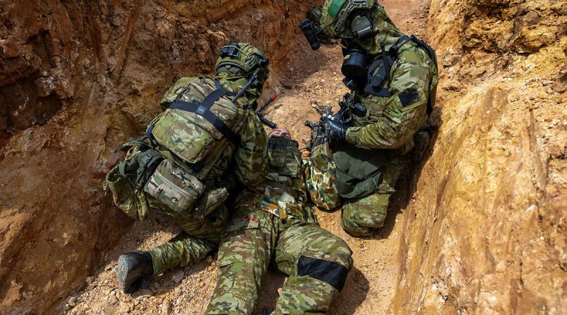 Army medics treat a simulated casualty during a trench warfare CBRN scenario as part of Exercise Rendezvous Acacia at the Wide Bay Training area, Queensland. Story b y Captain Nicholas Marquis. Photos by Leading Seaman Nadav Harel.