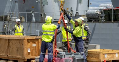 Support staff from Thales Australia, Port of Darwin and the ADF assist in the re-arming of HMAS Warramunga's vertical launching system in Darwin, NT. Story by Lieutenant Commander Jonathan White. Photos by Petty Officer Leo Baumgartner.