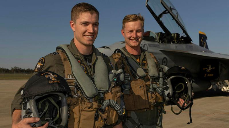 Aviators from 1 Squadron, Flight Lieutenants Nick and Slade, with a F/A-18F Super Hornet at RAAF Base Amberley prepare for their flying display. Story by Squadron Leader Tina Turner. Photo byCorporal Brett Sherriff.